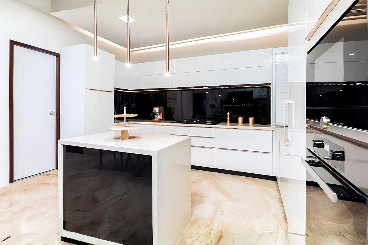 Modern kitchen with wood cabinetry, marble island, and pendant lighting