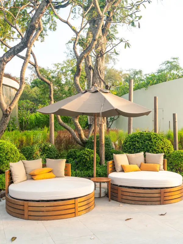 Zoned outdoor living layout with lounge and dining areas