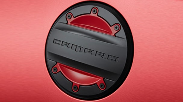 Fuel filler door in Black with Red Hot insert